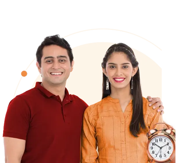 Smiling couple standing together against an orange background.