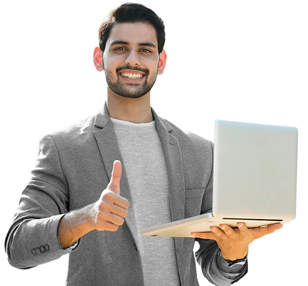 Smilling man in grey blazer holding a laptop and giving a thumbs-up gesture against a black background