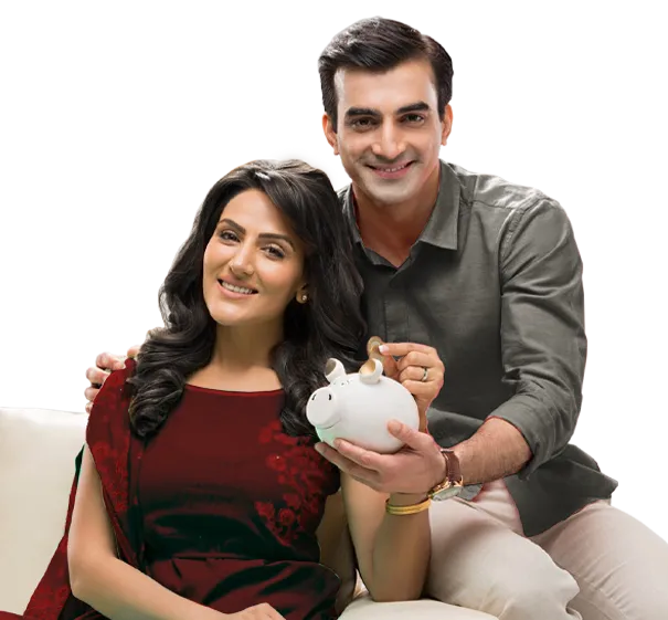 Smilling couple putting a coin into a piggy bank. - For ICICI Bank Deposits