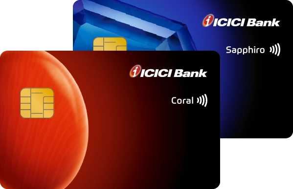 Two ICICI Bank credit cards, a blue "Sapphiro" and a red "Coral" card
