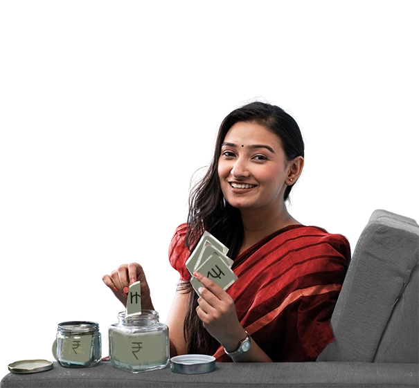 Smiling woman in red sari placing rupee note  into a savings jar while holding more currency notes