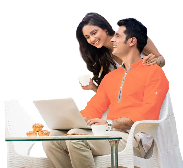 Couple using laptop together at home.