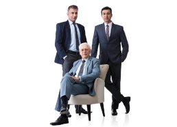  Silhouette of two business professionals standing together.